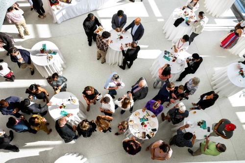 Individual at cocktail tables from above. 