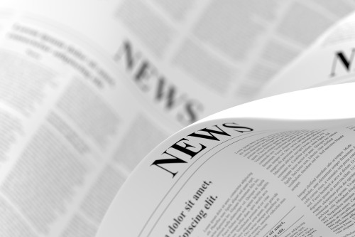 Newspaper folding over. 