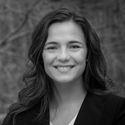 Black and white photo of woman with long hair smiling.